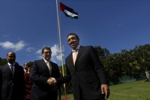 The United Arab Emirates foreign minister, Abdullah bin Zayed Al Nahyan, shakes hands with his opposite number in Cuba, Bruno Rodríguez, after raising the UAE flag at the opening of the Emirati embassy in Havana on Oct. 5, 2015. Credit: Jorge Luis Baños/IPS