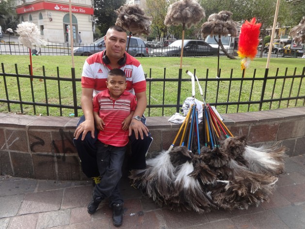 Despite a 15 percentage point drop over the last decade, 35 percent of the population of Argentina still works in the informal economy, like Daniel Reynoso, who supports his family selling dusters on a busy street in central Buenos Aires. Credit: Fabiana Frayssinet/IPS
