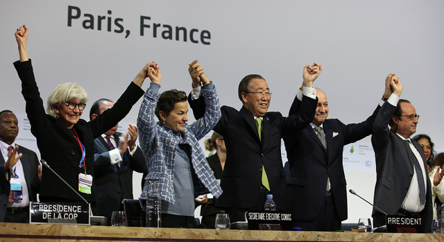 On Dec. 12, 2015, at the end of COP 21, United Nations Secretary-General Ban Ki-moon (centre) and other dignitaries celebrated the historic Paris Agreement on climate change, to be signed this week in New York. Credit: United Nations