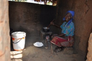 Felistas Ngoma, 72, from Nkhamenya in the Kasungu District of Malawi, prepares nsima in her kitchen. Credit: Charity Chimungu Phiri/IPS