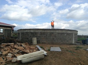 African Water Bank technicians put the final touches on a water storage tank at a homestead in the Duka Moja area of Narok County, Kenya. Credit: Justus Wanzala/IPS