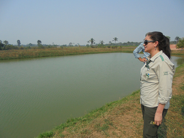  Domingo Mendes stands next to one of the tanks where he holds wastewater from raising pirarucú or arapaima fish, used to irrigate vegetable gardens, fruit trees and açaí palm trees, which he grows on part of his farm in Santa Rita, in northwest Brazil. Credit: Mario Osava/IPS