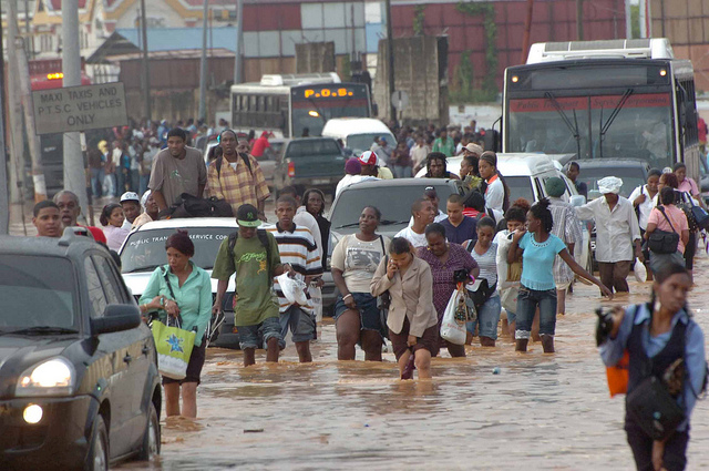 Residents make their way through the flooded streets of Port of Spain, Trinidad. Credit: Desmond Brown/IPS