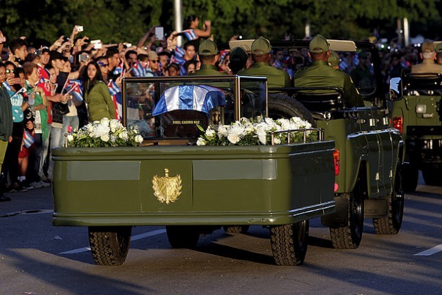 The urn holding the ashes of Fidel Castro is seen covered by a Cuban flag on a military jeep on Nov. 30, at the start of an 800-km funeral procession that will reach a cemetery in Santiago de Cuba on Dec. 4. Credit: Jorge Luis Baños/IPS