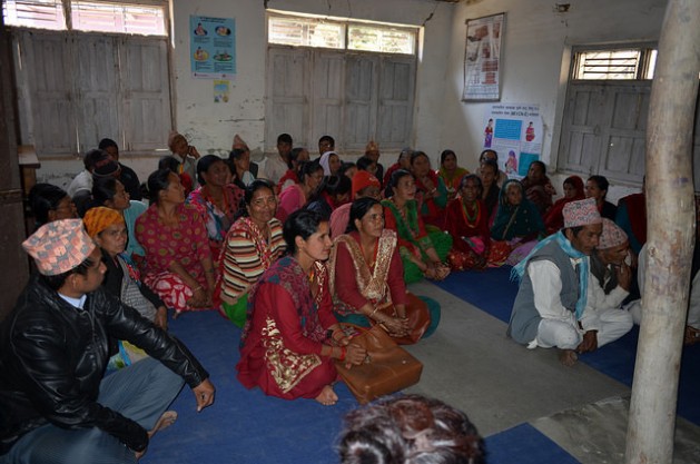Juna Bhujel (looking at the camera) at the Mankha VDC office to complain about non-payment of disaster relief funds to reconstruct housing. She lost her home in Nepal’s April 2015 earthquake. Credit: Renu Kshetry/IPS