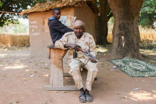 Seleka MPC fighters at a roadblock in Bojomo, Ouham province, with a desk they removed from the local school. © 2017 Edouard Dropsy for Human Rights Watch