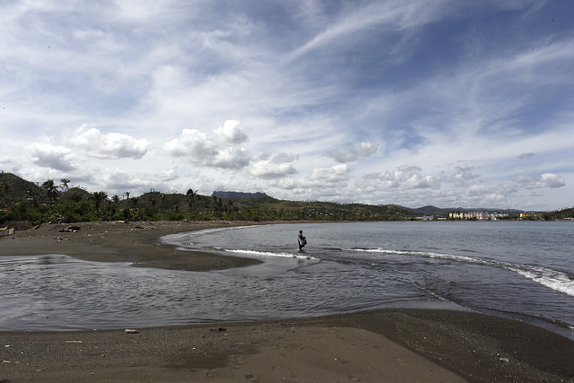 A man fishes on the beach next to the mouth of the Macaguaní River in the Caribbean Sea, on the outskirts of the city of Baracoa in eastern Cuba. Credit: Jorge Luis Baños/IPS