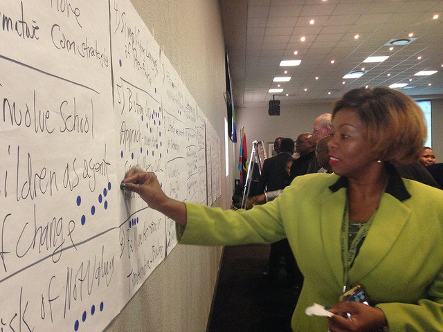 Participants at the High Level Panel on Water in Johannesburg add their comments to the principles for water. Credit: Paula Fray/IPS