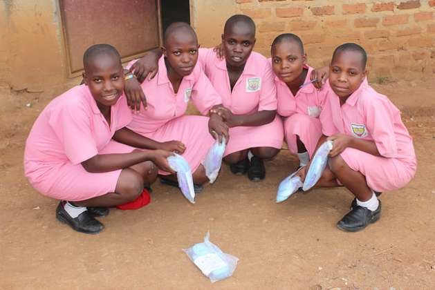 Students from Great Horizon Secondary School in Uganda's rural Kyakayege village pose proudly with their re-usable menstrual pads after a reproductive health presentation at their school. Credit: Amy Fallon/IPS