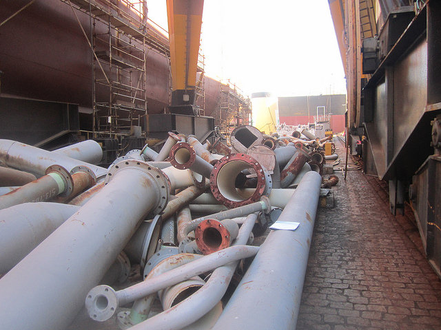Large bore tubes abandoned in the Maua Shipyard, in southeast Brazil, after the cancellation of the contract for building three large ships for transporting fossil fuels on the part of a subsidiary of the state oil company Petrobras. Credit: Mario Osava/IPS