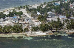 An aerial view of the Village of Kolhuvaariyaafushi, Mulaaku Atoll, the Maldives, after the Indian Ocean Tsunami. Credit: UN Photo/Evan Schneider