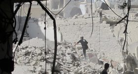 A civil defence team search for survivors after a barrel bomb attack in Aleppo Syria in August 2014. Credit: Shelly Kittleson/IPS