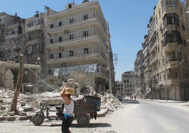 World Humanitarian Day / Syrian boy brings bread back from underground bakery in severly damaged opposition-held area of Aleppo. August 2014. photo credit Shelly KittlesonIPS