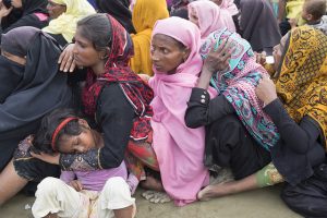 Women and children who escaped the brutal violence in Myanmar wait for aid at a camp in Bangladesh. Credit: Parvez Ahmad/IPS