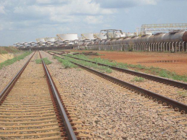 A train and biofuel storage tanks seen in the yard of the North-South Railway in Porto Nacional, final point of the stretch in operation since 2013, which is using only half of its capacity, most of it to carry soybeans and by-products for export. Credit: Mario Osava / IPS