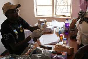 Laboratory Technician Herbert Mtopa collects biological samples at a clinic in Zimbabwe's Shamva District under a CultiAF project to assess exposure of women and children to aflatoxins. Credit: Busani Bafana/IPS