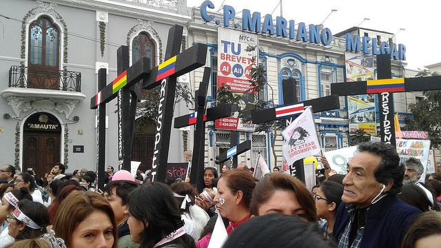 Protesters holding black crosses symbolising the victims of femicide in Peru and other Latin American countries held a massive march through the centre of Lima in August 2015 under the slogan "Ni Una Menos" (Not one [woman] less). Credit: Noemí Melgarejo / IPS