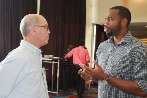 Dr. Donneil Cain (right), the Caribbean Community Climate Change Centre's (CCCCC) project development specialist who worked with the BWA on the Barbados Water Resilience Nexus for Sustainability Project, in discussion with Dr. Adrian Cashman from the University of the West Indies, Cave Hill on the educational institutions that assisted with the project's development. Credit: Zadie Neufville