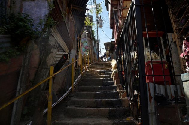 A young couple walk down a steep stairway in La Carpio, a poor neighbourhood on the outskirts of San José, Costa Rica. About half of the young people living in communities like this one in Central America say they would migrate if they could. Credit: Josué Sequeira/IPS