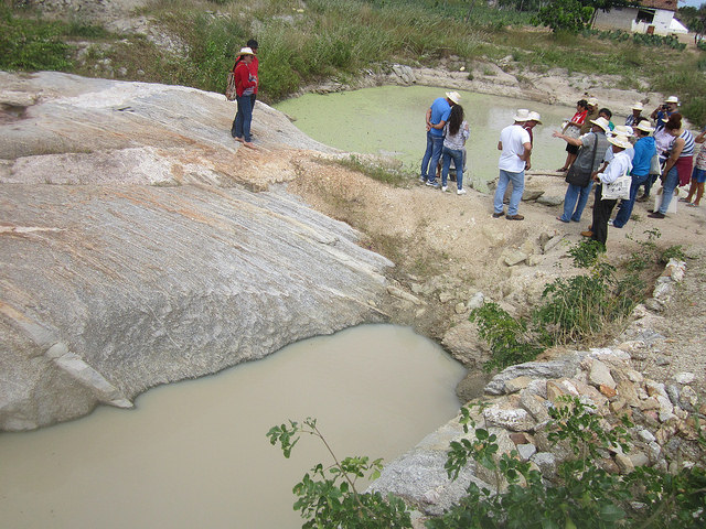 Two of the four stone ponds on the farm belonging to Pedrina Pereira and João Leite, built by Leite with the help of neighbours, in a farming community in Juazeirinho. The tanks store rainwater for their livestock and their diversified crops during the frequent droughts in Brazil’s semi-arid ecoregion. Credit: Mario Osava/IPS