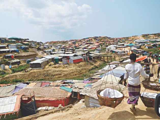 A Rohingya refugee finds an enterprising way to carry his belongings. PHOTO: NAYANA BOSE/ISCG
