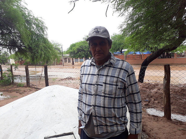 Antolín Soraire, a "criollo" farmer from the Chaco region of Salta, stands in front of one of the tanks he built in Los Blancos to collect rainwater, which provides families with drinking water for their needs during the six-month dry season in northern Argentina. Credit: Daniel Gutman/IPS