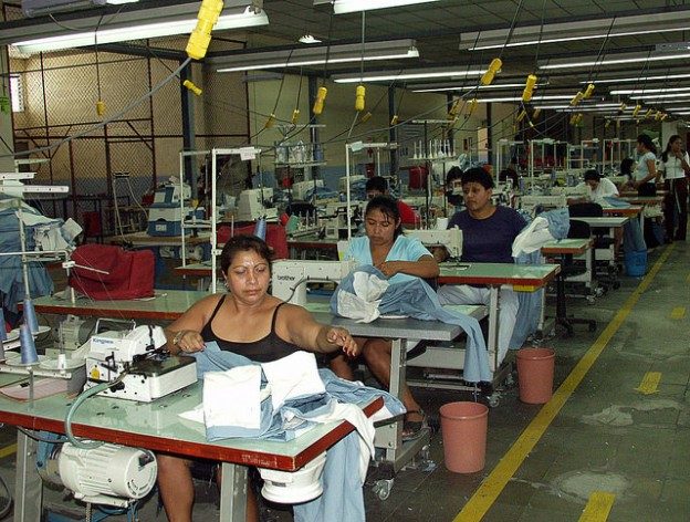 Factory workers make sportswear for a U.S. brand at a maquila plant in El Salvador. Credit: Edgar Romero/IPS
