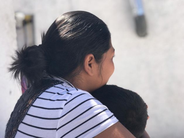 “Carmen S.” holds her son, 3, at a shelter where they were staying in Ciudad Juárez, Mexico, May 2019, after being returned to Mexico under the Trump administration’s “Migrant Protection Protocols.” Carmen told Human Rights Watch that she was thinking of trying to cross illegally but was afraid of losing her children. © 2019 Clara Long/Human Rights Watch