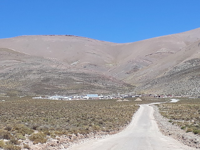 View of the village of Olaroz, at an altitude of 4000 metres, with the Andes foothills in the background. Across from this town in Argentina's Puna region is the Olaroz salt flat, where foreign companies extract lithium. However, the lithium batteries that today store the town's solar energy are imported. Credit: Daniel Gutman/IPS