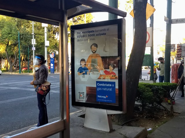 An ad for household gas at a bus stop in Mexico City. The Mexican government promotes the exploitation, distribution and consumption of natural gas, despite the social conflicts and environmental impacts that the industry causes. CREDIT: Emilio Godoy/IPS