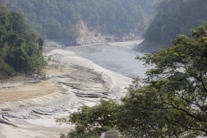 Studies show that glaciers in India are permanently losing ice, not only owing to higher temperatures from global warming but also in response to “deprived precipitation conditions” High siltation as the Teesta, a Himalayan glacier-sourced river which rises from the Eastern Himalayas, is dammed at the Teesta barrage at Siliguri, West Bengal. Credit: Manipadma Jena/IPS