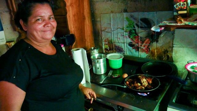 María Ángela (“Angelita”) Cortés, 52, prepares a dish in her mini-restaurant on the beach of Punta Remedios, in the hamlet of Los Cóbanos on El Salvador’s Pacific coast. She takes advantage of the return of tourists to boost her business in an area with few job opportunities besides fishing, which is increasingly scarce due to the damage suffered by the local coral reef. CREDIT: Edgardo Ayala/IPS