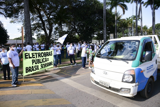 "Public Eletrobras = Sovereign Brazil" reads a banner at a protest in Brasilia against the privatisation of Brazil's largest electric company. Its privatisation, as approved by Congress, includes projects for natural gas-fired thermoelectric power plants which, according to experts, will lead to further hikes in the price of electricity for consumers. CREDIT: Pedro França/Agência Senado- Public Photos