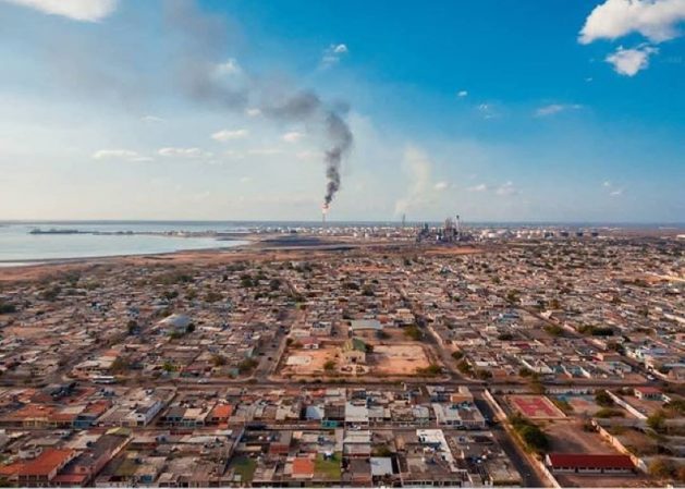 A partial view of the city of Punto Fijo, with the Cardón refinery in the background, on the Paraguaná peninsula, projected as a special economic zone overlooking the Caribbean in northwest Venezuela. CREDIT: Megaconstrucciones