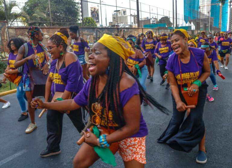 Afro-Peruvian women participate in a festive demonstration demanding respect for their rights, on the streets of Lima on International Women's Day, March 8, 2022. CREDIT: Courtesy of Lupita Sanchez