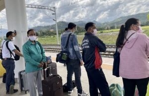 Travelers await the Laos-China Railway. Credit: Bridget Dooley/IPS - Living in a fertile and relatively large country with a small population, Laotian farmers are primed to move “beyond feeding themselves, from subsistence farming to enterprise farming”