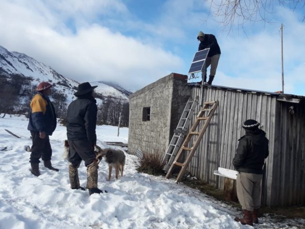 Installation of a solar panel on the roof of an isolated rural house in the southern province of Chubut, during the winter in Argentina's Patagonia region. Renewable sources provide energy to isolated communities that previously could only be supplied by diesel engines, which are more expensive, less efficient and generate greenhouse gas emissions. CREDIT: Permer
