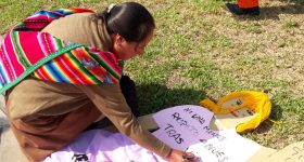 "Not one woman less, respect our lives” writes a Peruvian woman on the effigy of a woman in a park in front of the courthouse, before a demonstration in Lima over the lack of enforcement of laws against femicides and other forms of violence against women. CREDIT: Mariela Jara/IPS