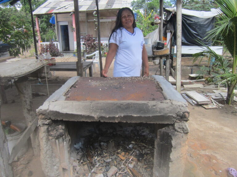 Diolinda Tempo, one of the few Venezuelan Kariña people in this majority Warao community, settled in the Cantá municipality in northern Brazil, where she produces casabe, a crunchy, thin, circular bread made from cassava flour, which she makes with a small mill invented by her father, Diomar Tempo. His cassava is the family's source of income. CREDIT: Mario Osava/IPS