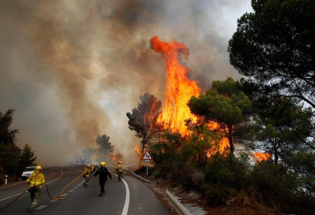 Firefighters battle a wildfire in Spain. July 2023 is the hottest month ever recorded in human history. Credit: Wikipedia