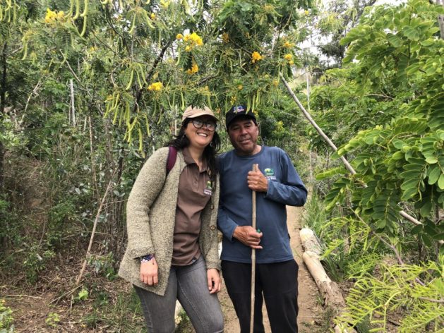 María José Valenzuela, Director of the Environment of the Chilean municipality of María Pinto, stands next to Mario Rojas, caretaker of the Miyawaki project, a pilot experience of this technique that works with little water and only requires irrigation for the first two years. A native forest has been created that improves the biodiversity of the area, in a municipality that defines itself as sustainable. CREDIT: Orlando Milesi / IPS - A return to nature is the main solution being promoted by communities and municipalities to avoid the water shortage that threatens to leave Santiago, the capital of Chile, without water