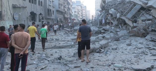 Men walk through a heavily damaged area of central Gaza. Credit: UN News/Ziad Taleb