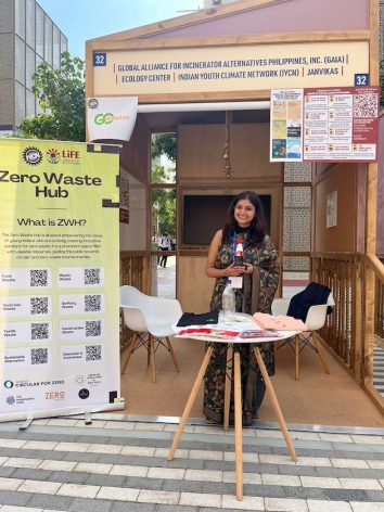 A woman sits among the plastic waste which will be recycled several times. Credit: Go Rewise