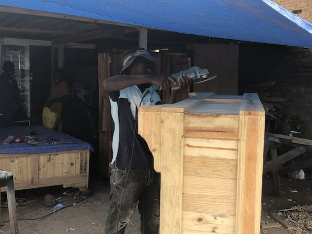 Tapera Saizi, a carpenter stationed at Juru Growth Point, has managed to take care of his family through his rural business. Credit: Jeffrey Moyo/IPS