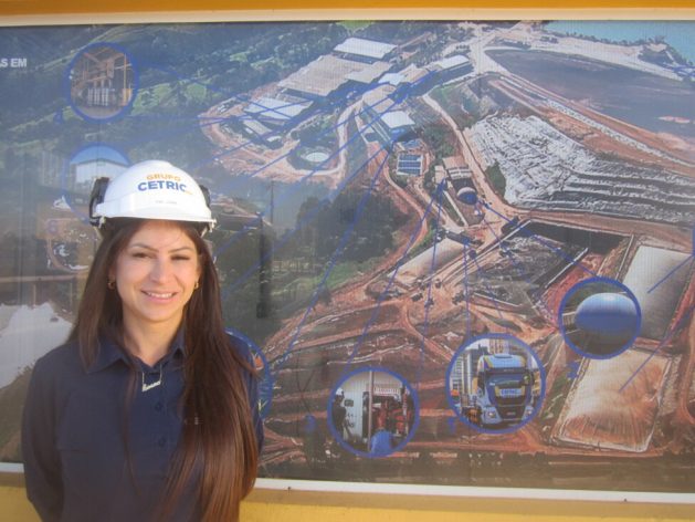 Loana Defaveri, technical manager of Cetric, is photographed at the bioenergy ecopark in Chapecó in southwestern Brazil. The aerial photo in the background shows the various components of the complex, which receives industrial waste and produces biogas, electricity, biomethane and other by-products. CREDIT: Mario Osava / IPS