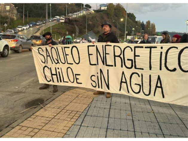 Residents of the municipality of Castro, in Chiloé, an archipelago in southern Chile, demonstrate in the streets of their city, in front of the Gamboa Bridge, expressing their fear of threats to the water supply that they attribute to the lack of protection of peatlands, which are key to supplying water for the island's rivers. CREDIT: Courtesy of Chiloé en defensa del Agua