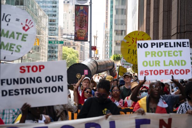 Opponents of the East African Crude Oil Pipeline protested American International Group's continued support of the project. The protest was in New York in July. Credit: 350.org
