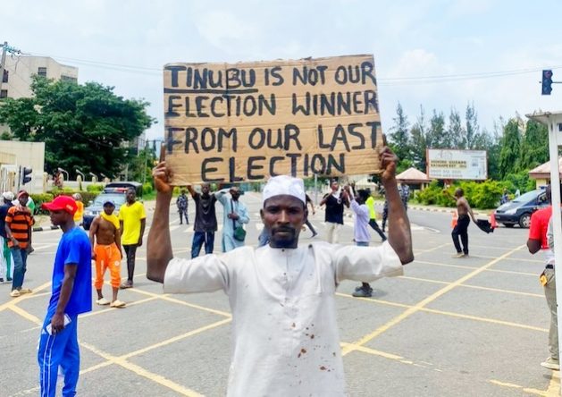 An #EndBadGovernanceInNigeria protestor in Abuja expresses his view on President Bola Tinabu. Credit: Promise Eze/IPS