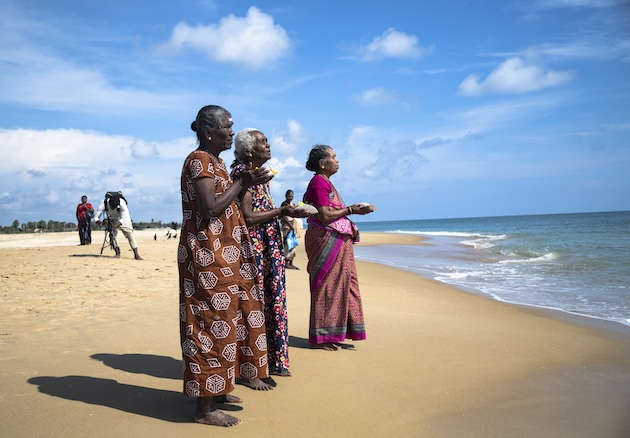 Women pray during the commemoration of the Mullivaikal massacre. Thousands died in no fire zones in the final days of the war. Credit: Johan Mikaelsson/IPS