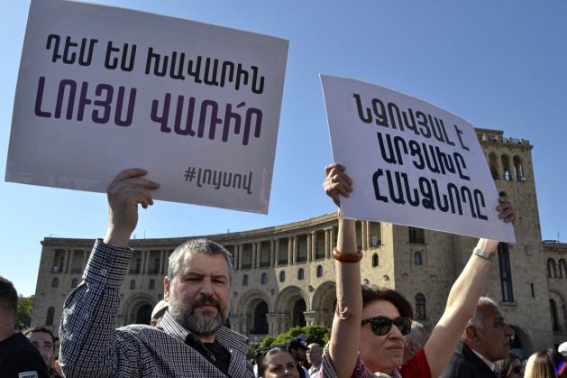 "Damn those who sell out Artsakh," read these banners during a demonstration in Yerevan last May. The displaced community is widely criticising the Armenian government's handling of the crisis. Credit: Sona Hovsepyan/IPS.
